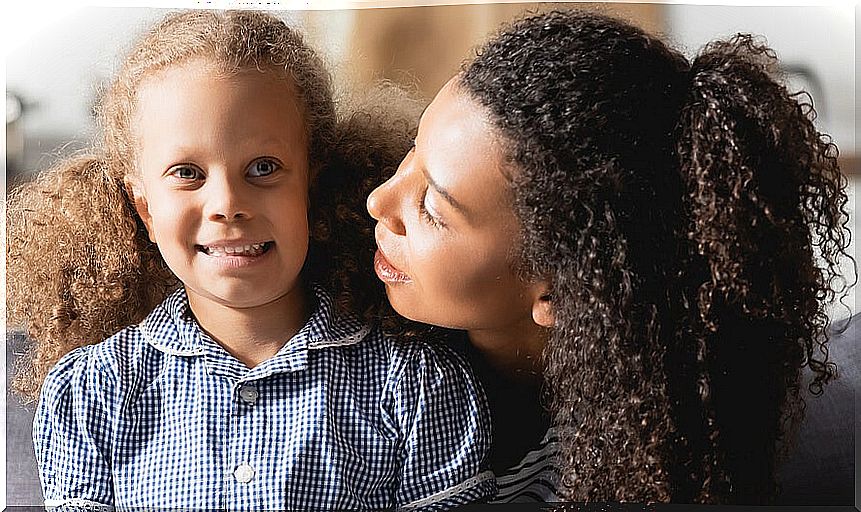 Mother with her daughter learning to show authority from love.