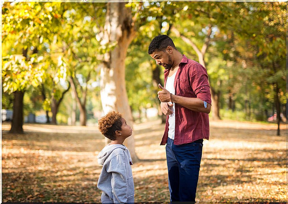 Father talking to his son about coping with adversity.