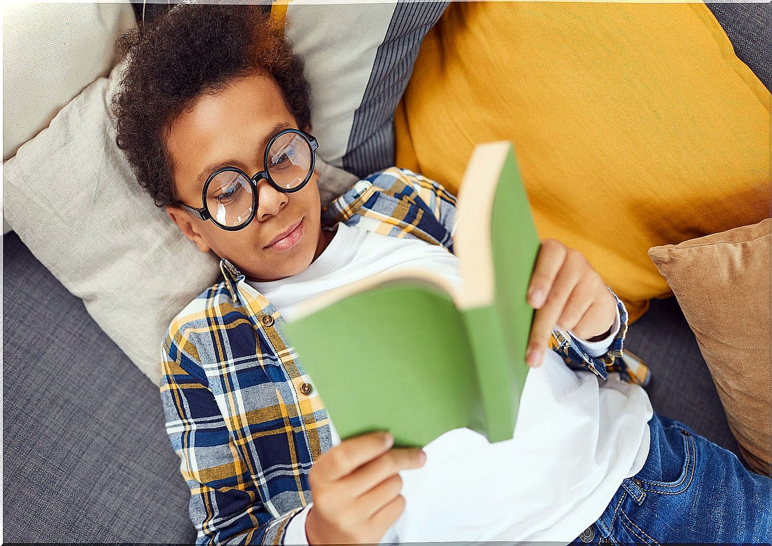 Teen boy reading.