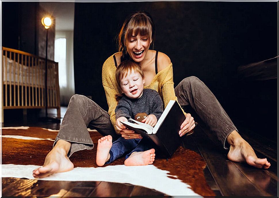 Mother reading to her son one of the stories to learn to add.