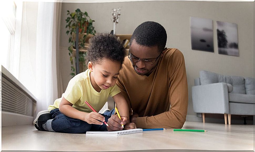 Father and son playing games using only pen and paper.