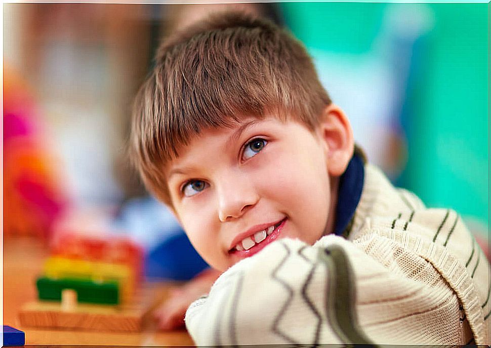 Child with special needs smiling.