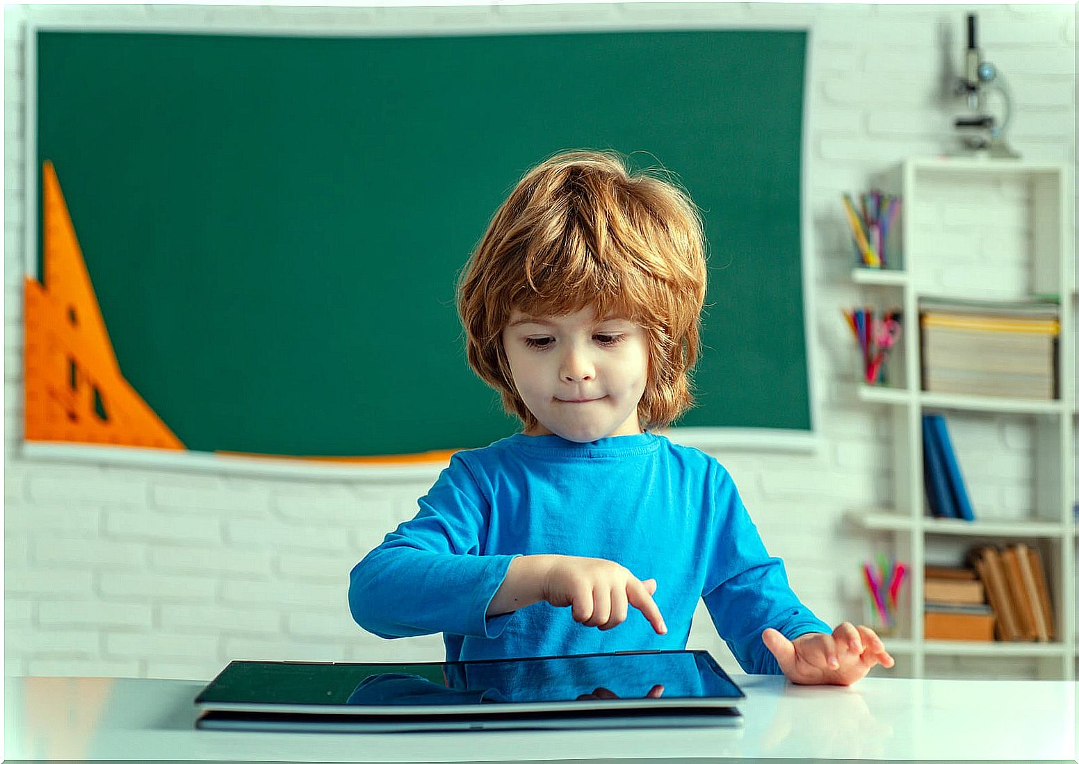 Child in Kindergarten class receiving a digital education.