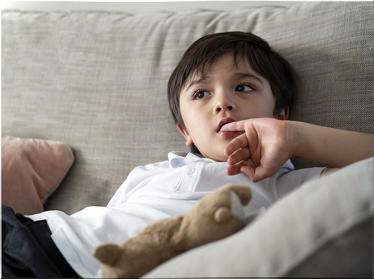 Child biting his nails.