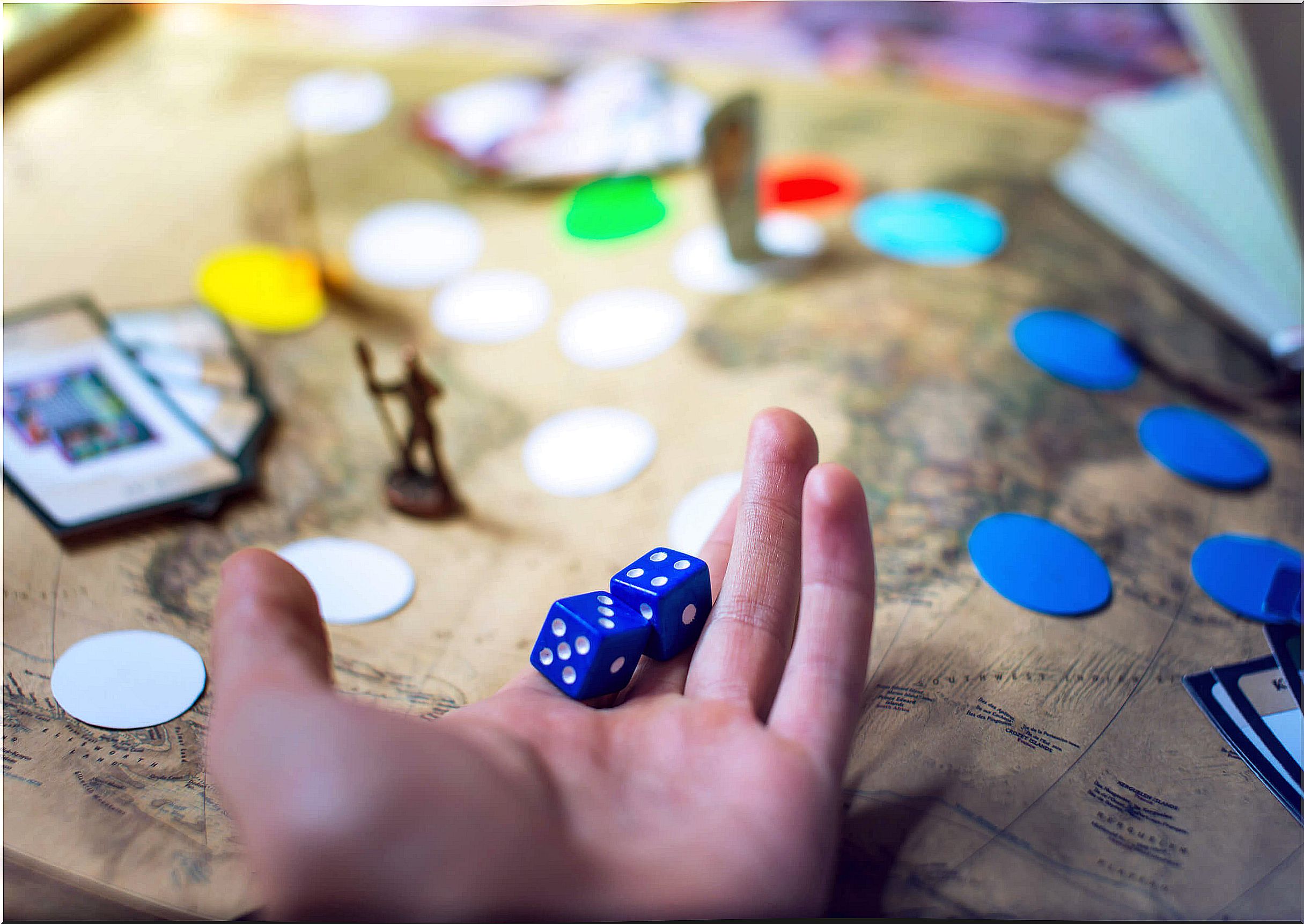 Family playing cooperative board games.