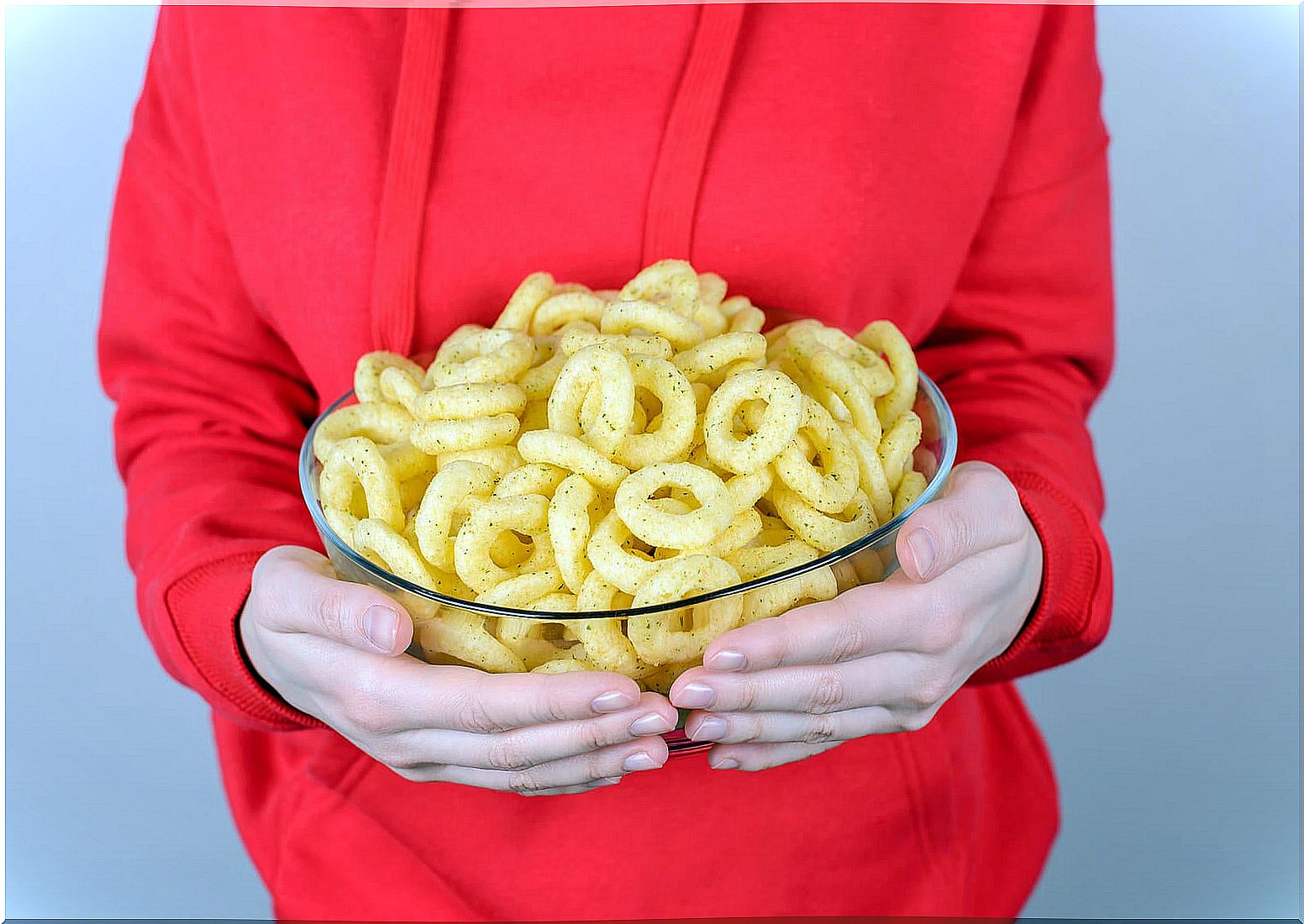 Girl with a giant bowl of hooks because she suffers from emotional hunger.