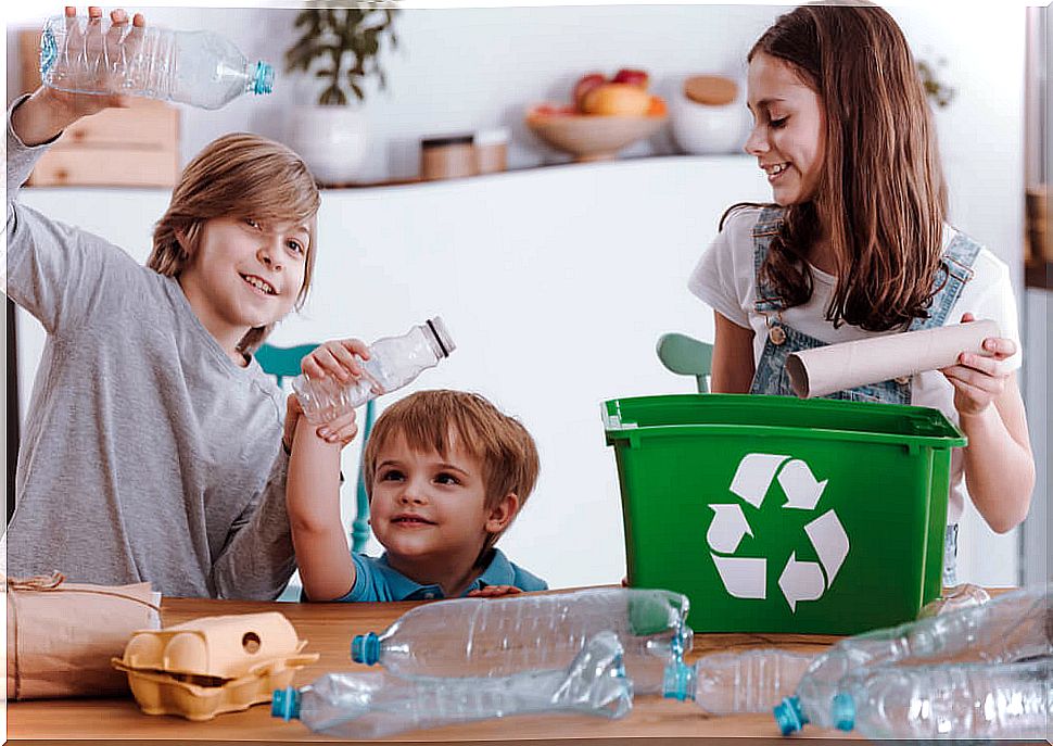 Children recycling at home with recycling games.