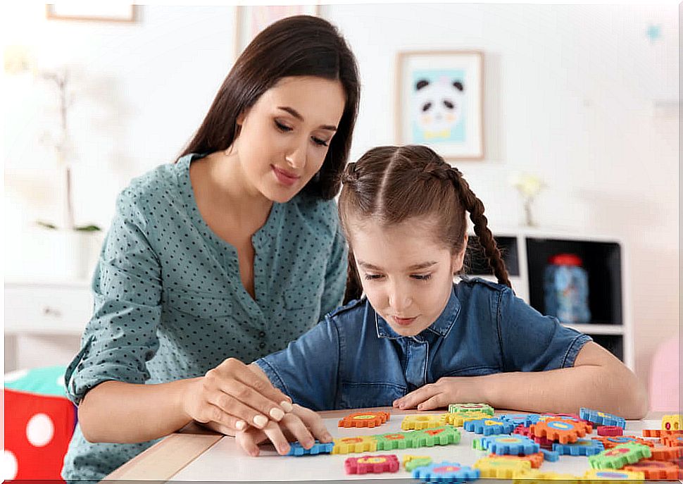 Girl with ASD working with the speech therapist.