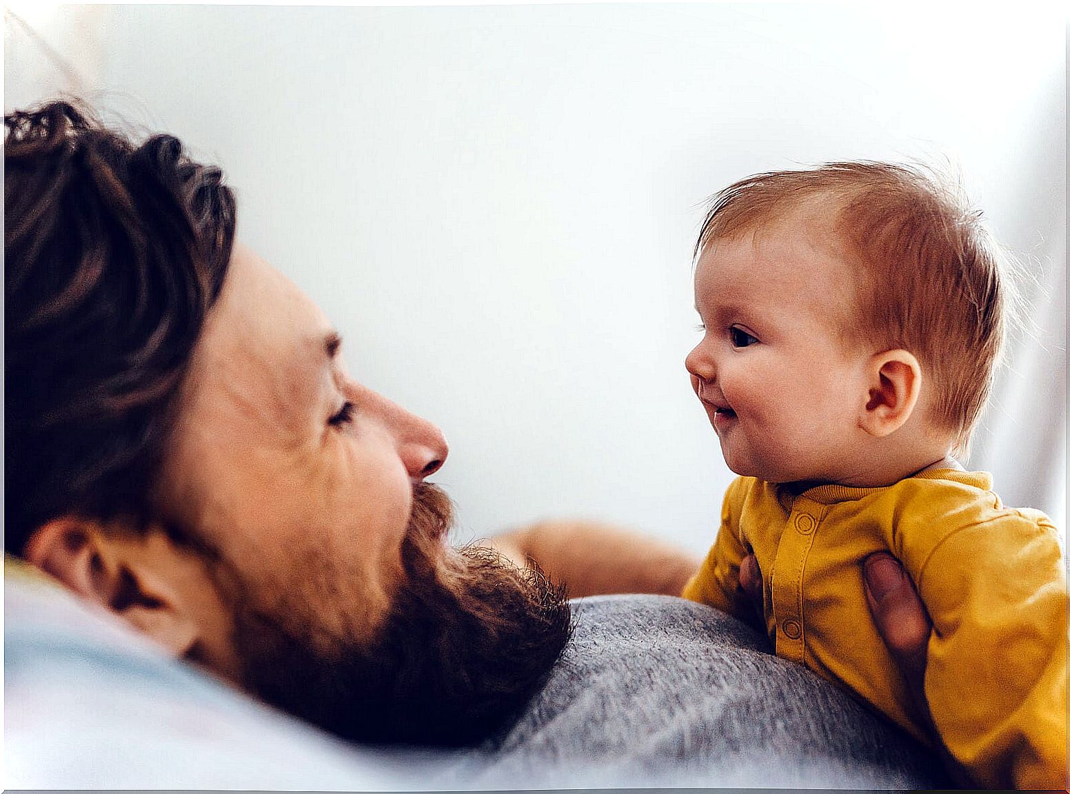 Father talking to his baby.