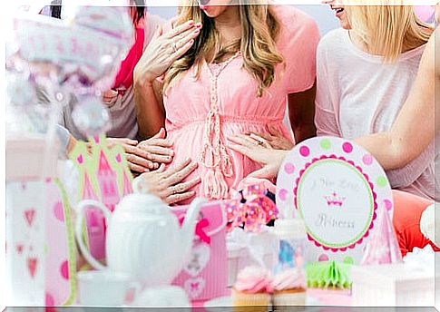 Preparing for the baby shower involves food, decorations, and games.