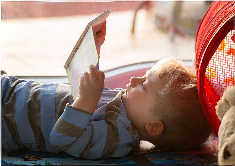 Child reading an Openly game-book.