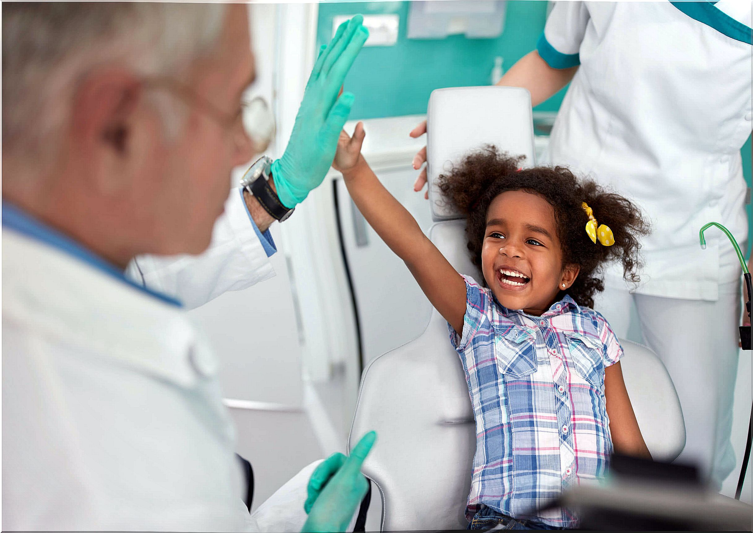 Happy girl at the dentist.