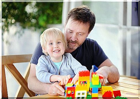 Father and son enjoying the psychological benefits of LEGO.