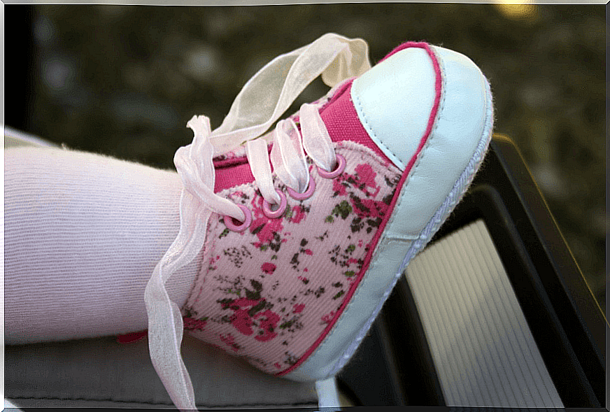 Summer fashions for babies include cool and comfortable shoes.