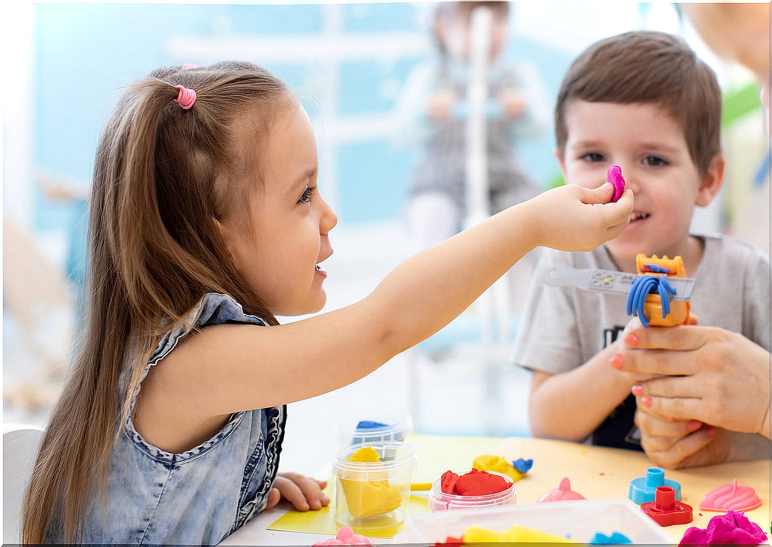 Child playing with plasticine.