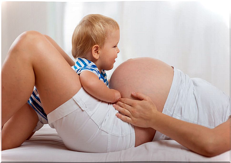 Boy with his pregnant mom